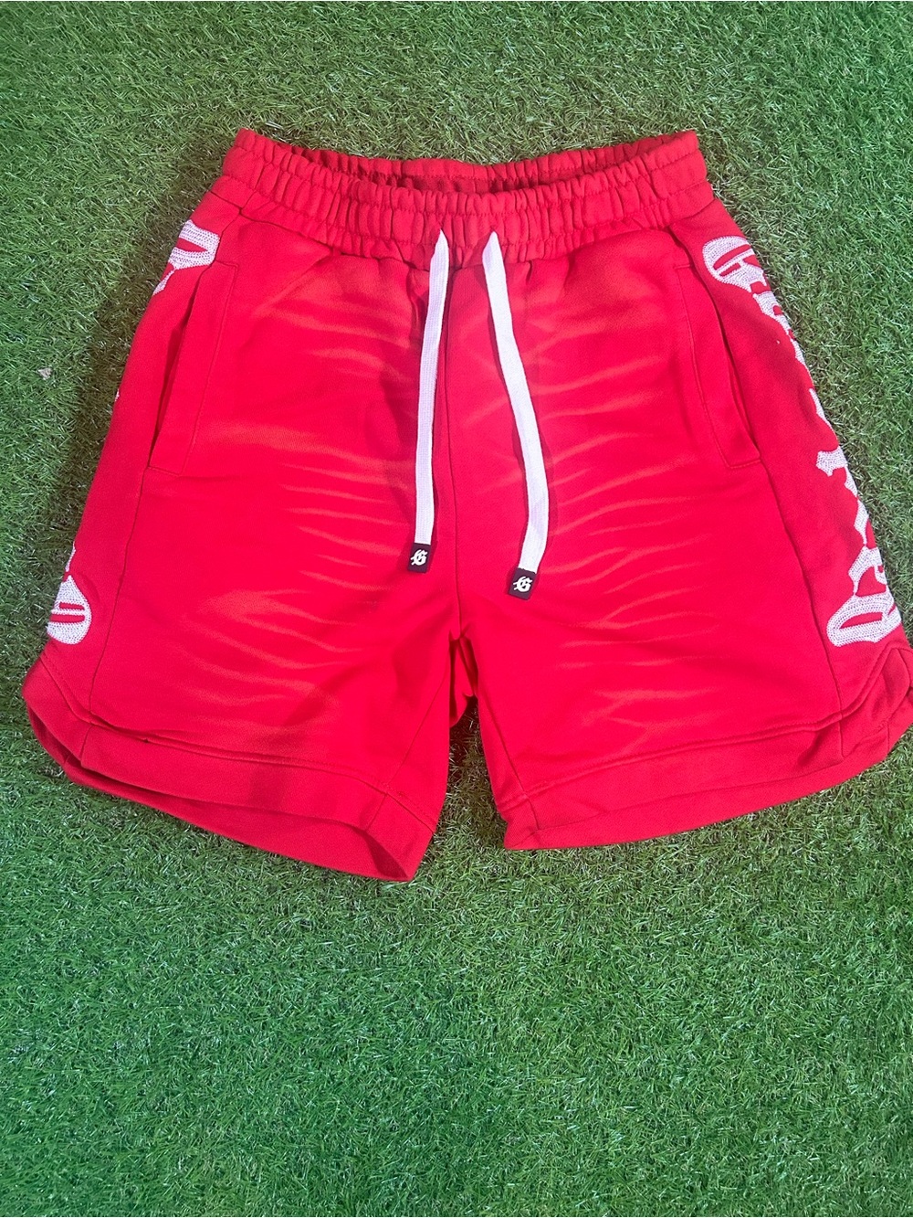 red/white godspeed shorts
